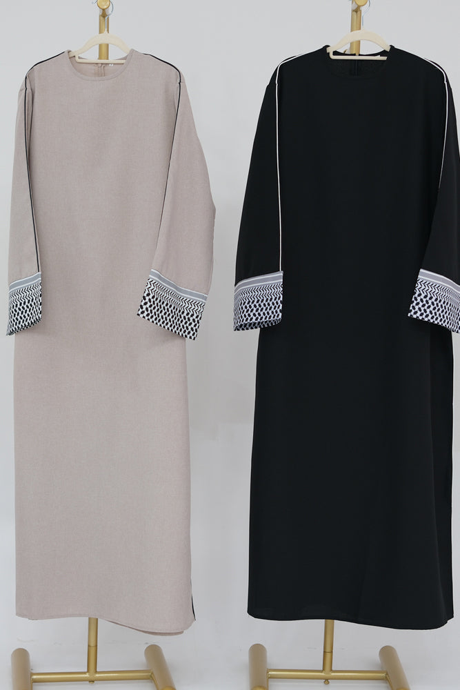 Umm Obeida Traditional abaya with contrast keffiya cuffs and piping alongside hems