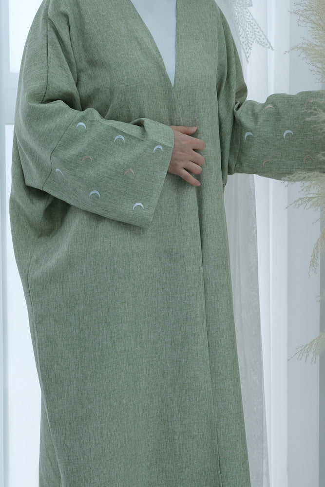 Light Green Moona abaya throw over with moon embroidery on sleeves