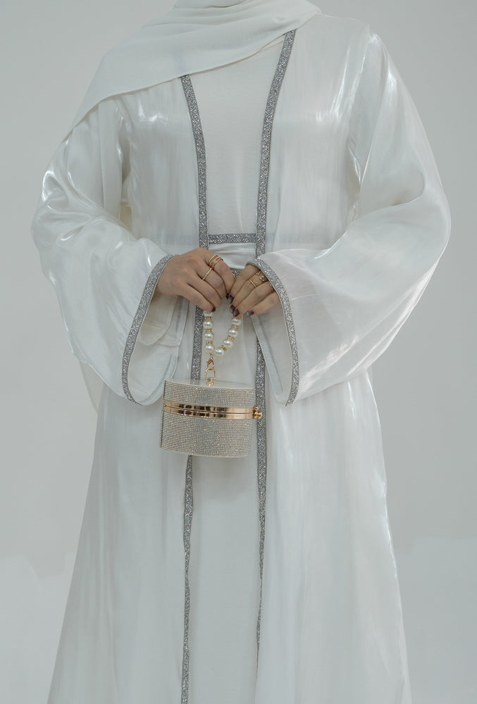 Tanju White abaya throw over with embroidery detailing along front hem and on sleeves with matching belt