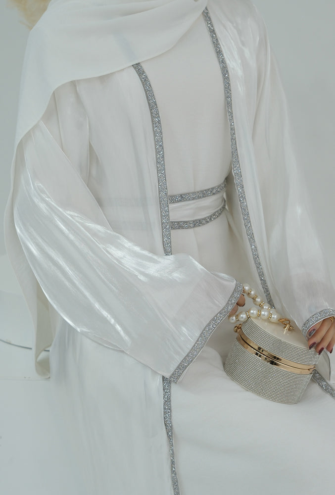 Tanju White abaya throw over with embroidery detailing along front hem and on sleeves with matching belt