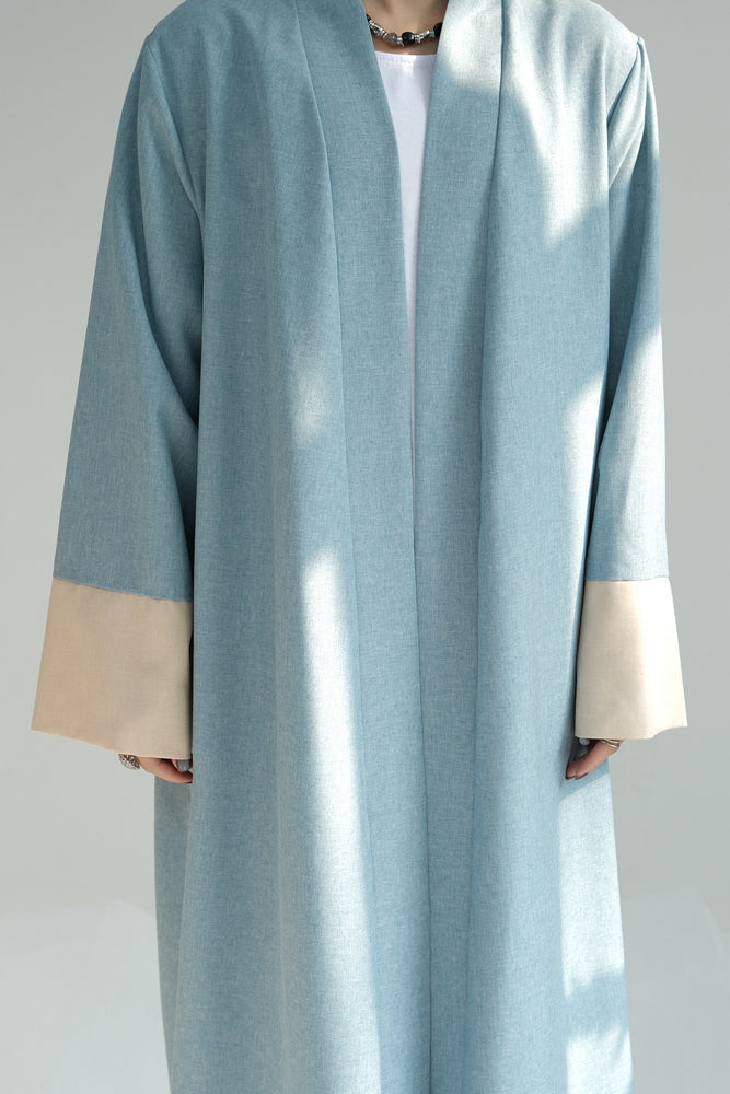 Hina in Blue casual sporty abaya throw over with contrast sleeve cuffs in beige open front abaya