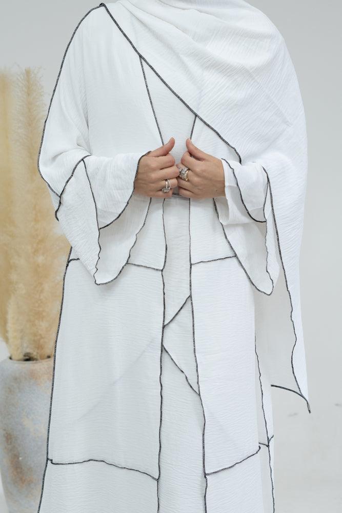 Eliza 4 piece abaya set with slip dress, abaya cape, apron with matching scarf in white with contrast overlock stitching in black - ANNAH HARIRI