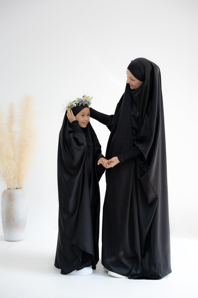 Little Gretaah prayer gown for kids in khimar style with ribbed sleeve cuff in Black - ANNAH HARIRI