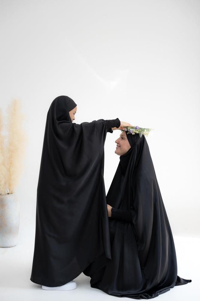 Little Gretaah prayer gown for kids in khimar style with ribbed sleeve cuff in Black - ANNAH HARIRI