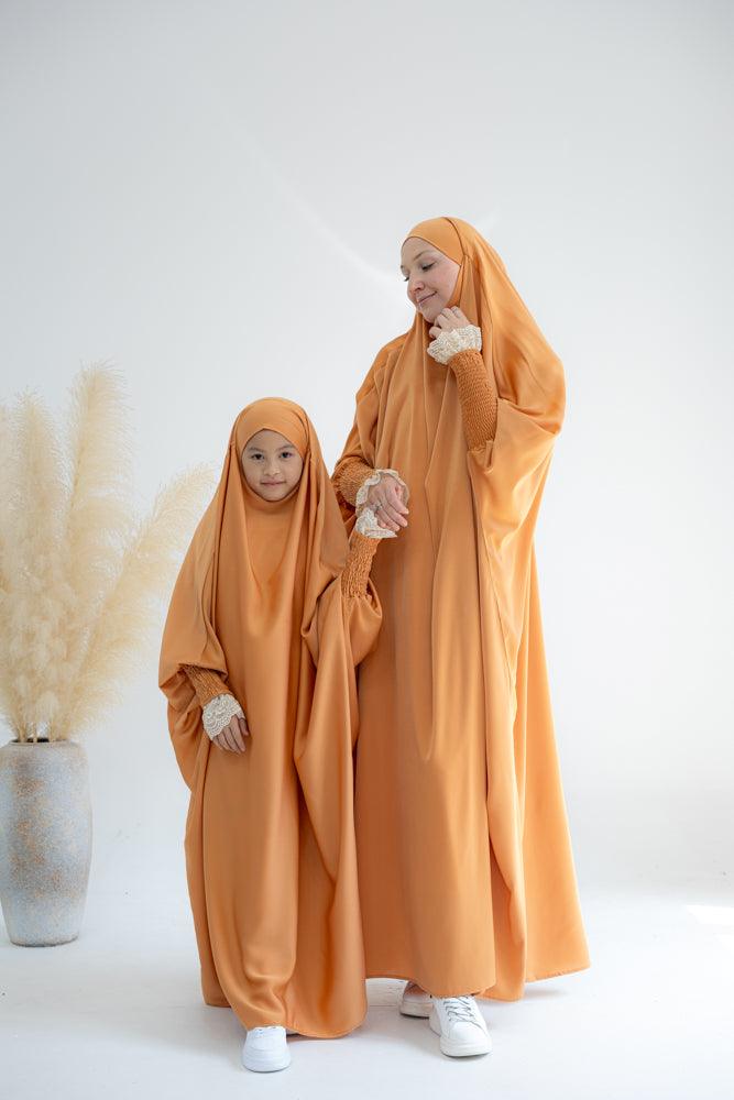 Little Gretaah prayer gown for kids in khimar style with ribbed sleeve cuff in Orange - ANNAH HARIRI