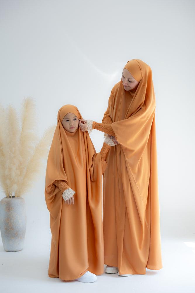 Little Gretaah prayer gown for kids in khimar style with ribbed sleeve cuff in Orange - ANNAH HARIRI