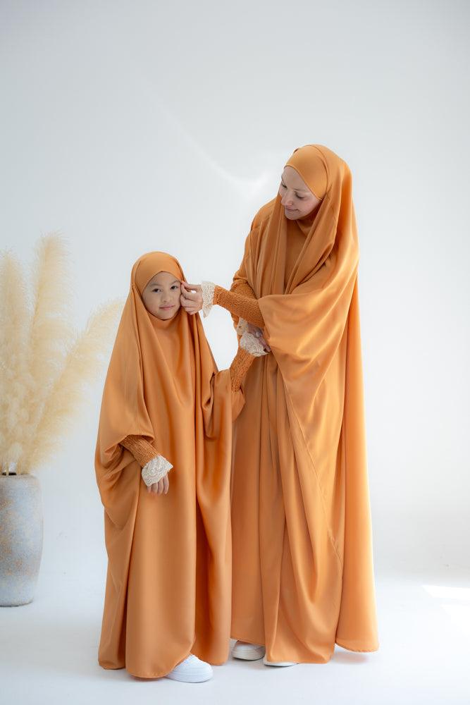 Little Gretaah prayer gown for kids in khimar style with ribbed sleeve cuff in Orange - ANNAH HARIRI