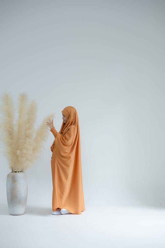 Little Gretaah prayer gown for kids in khimar style with ribbed sleeve cuff in Orange - ANNAH HARIRI