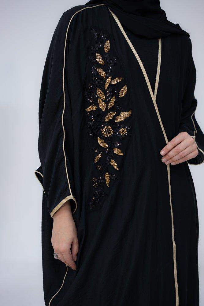 Queen Bisht with golden color embroidery and batwing cut in black - ANNAH HARIRI