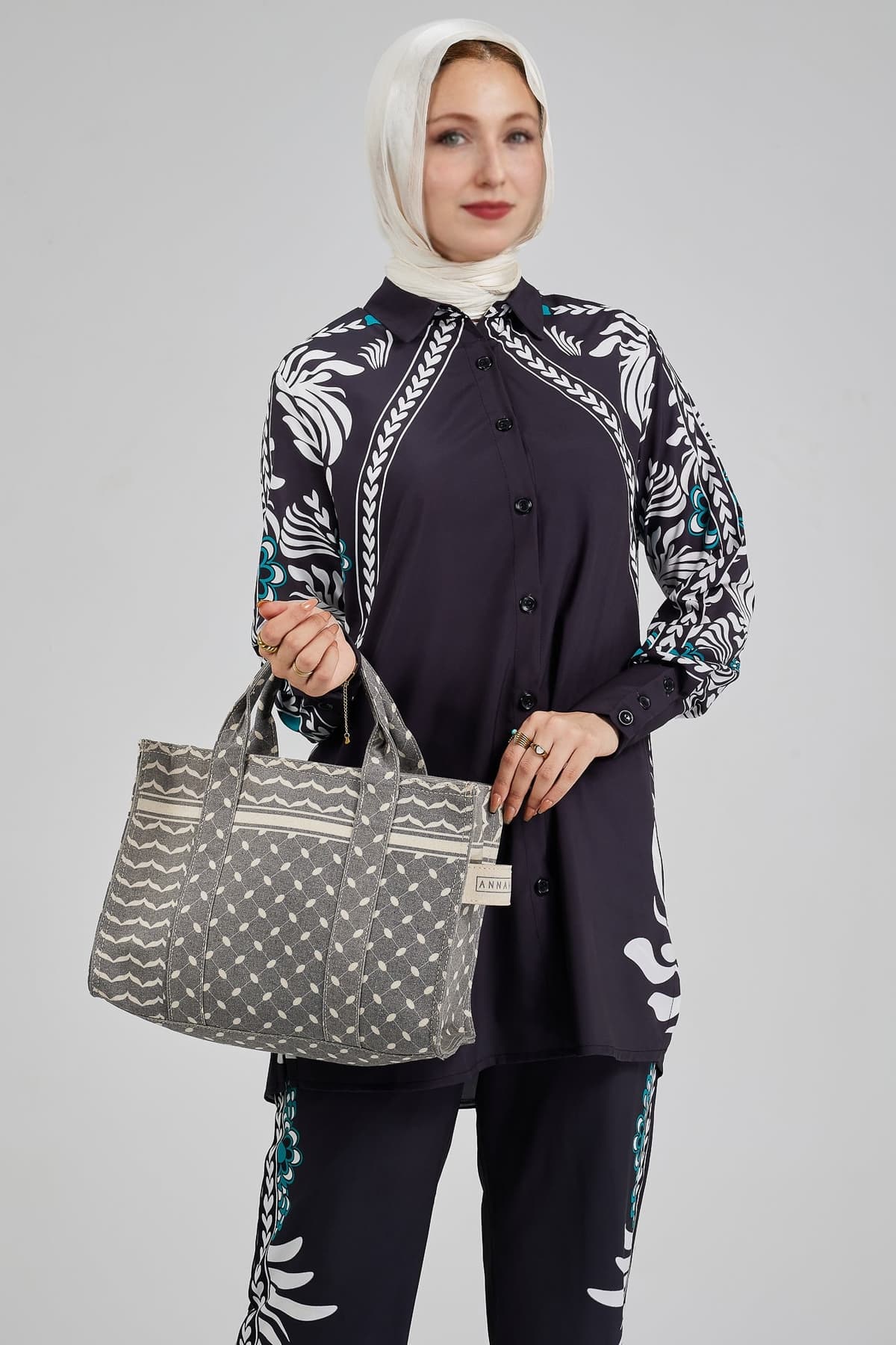 Closeup of Celeste floral button-down tunic with matching trousers