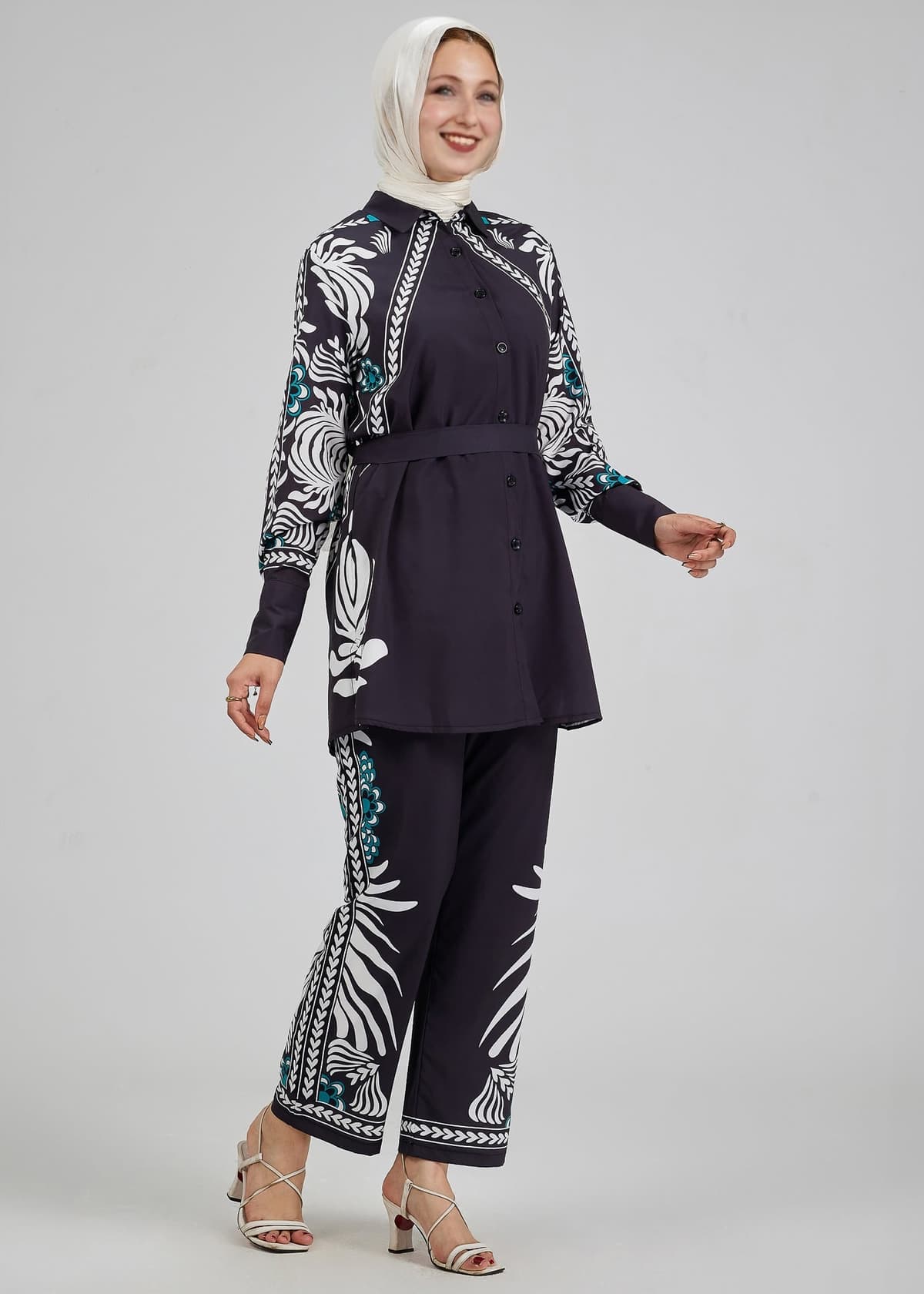 Angled view of Celeste floral button-down tunic with matching trousers