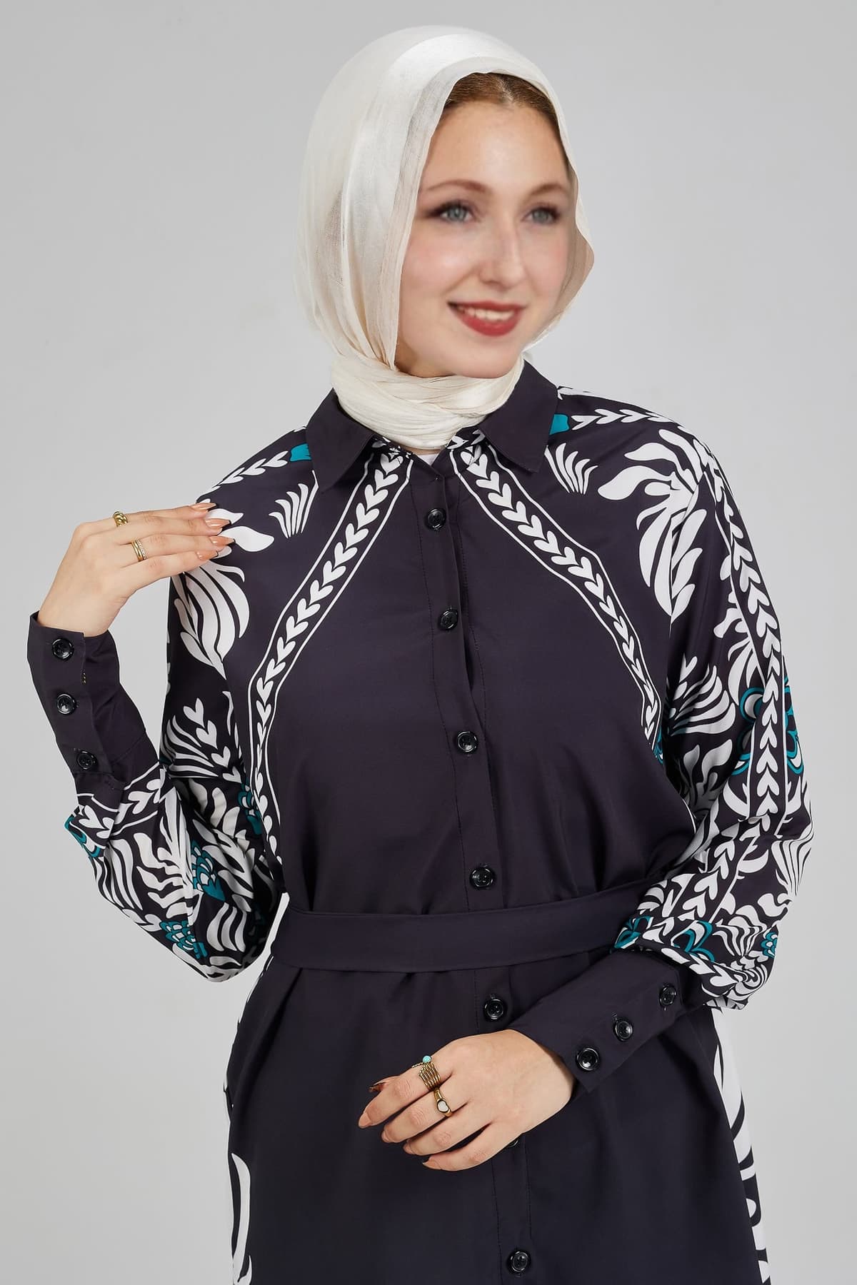 Model wearing Celeste floral button-down tunic with matching trousers and smiling