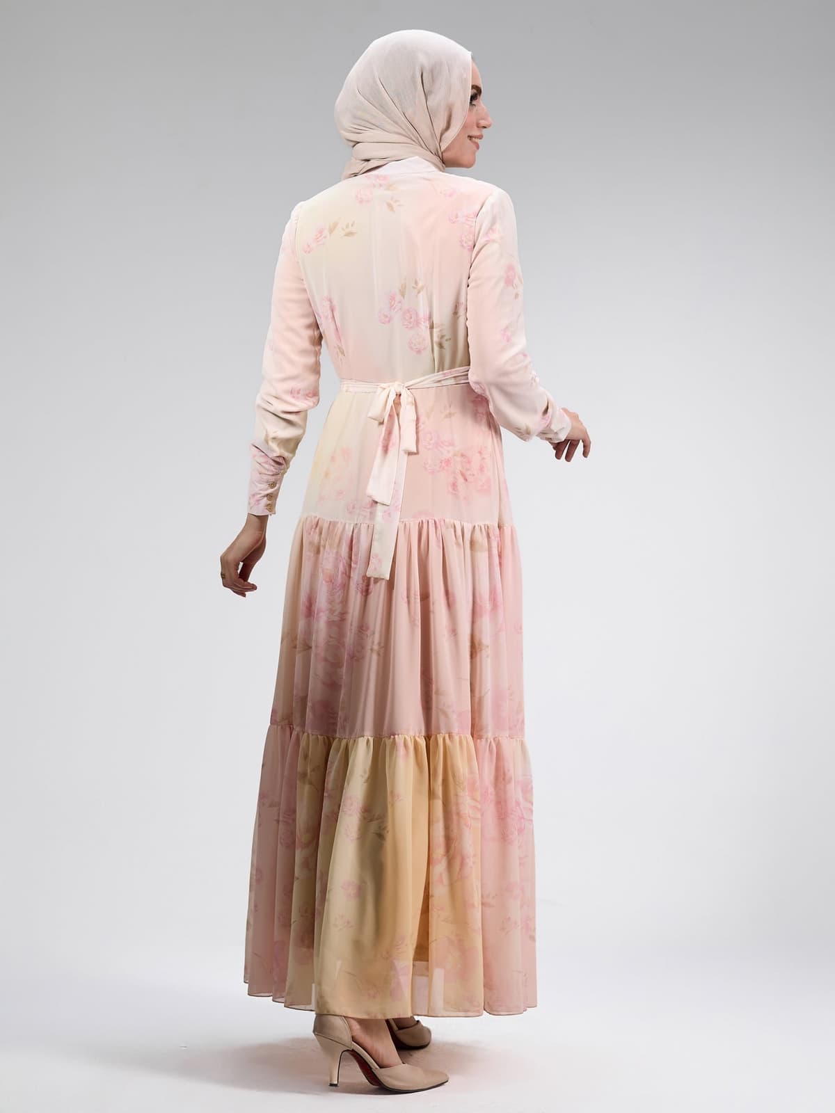 Full-length view of the elegant chiffon floral dress in soft pink