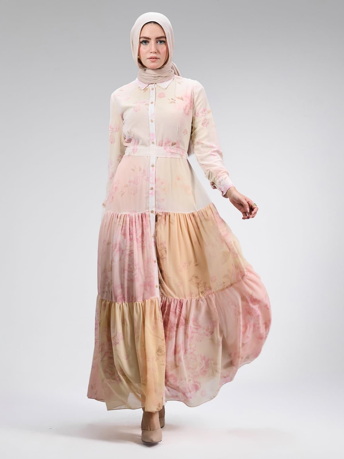 Back view of the blush pink maxi dress with a tie detail