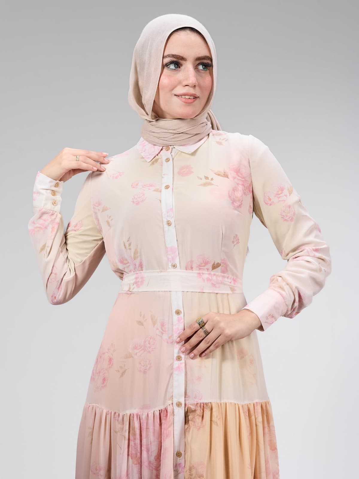Rear view of the elegant floral chiffon dress, featuring a tied waist