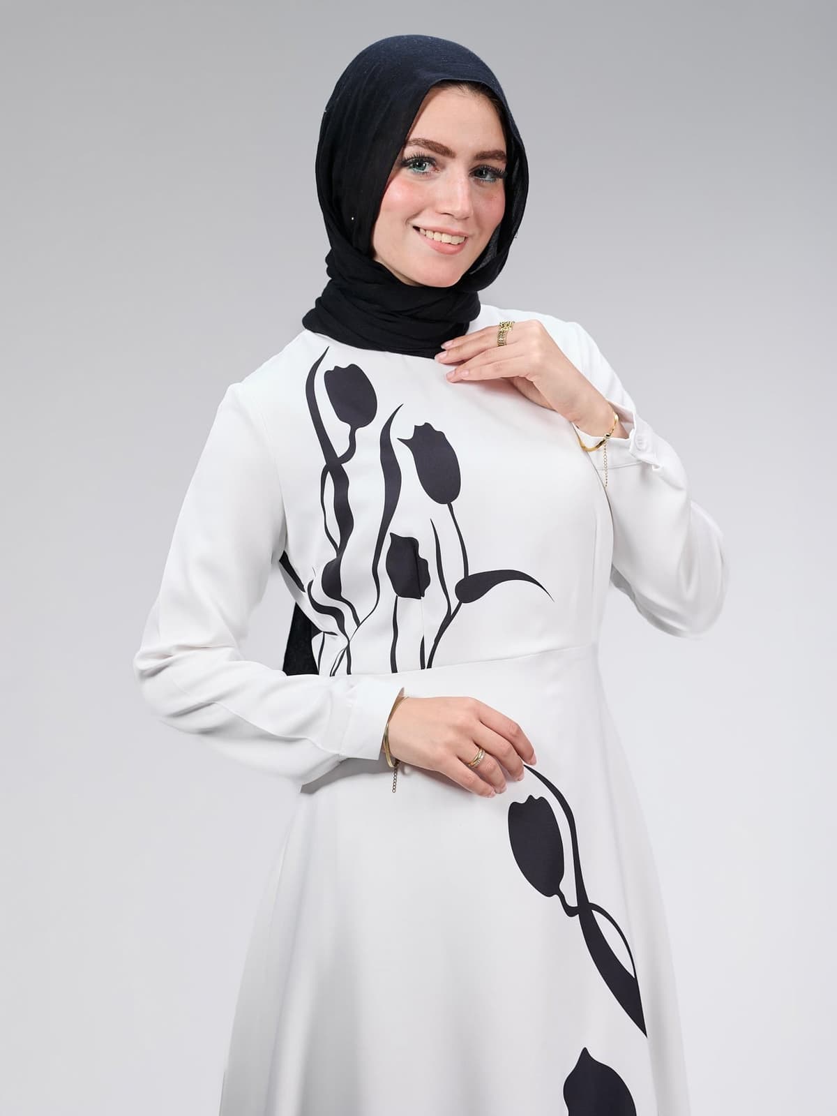 Model wearing Graceful Tulip Crepe Maxi Dress, side view