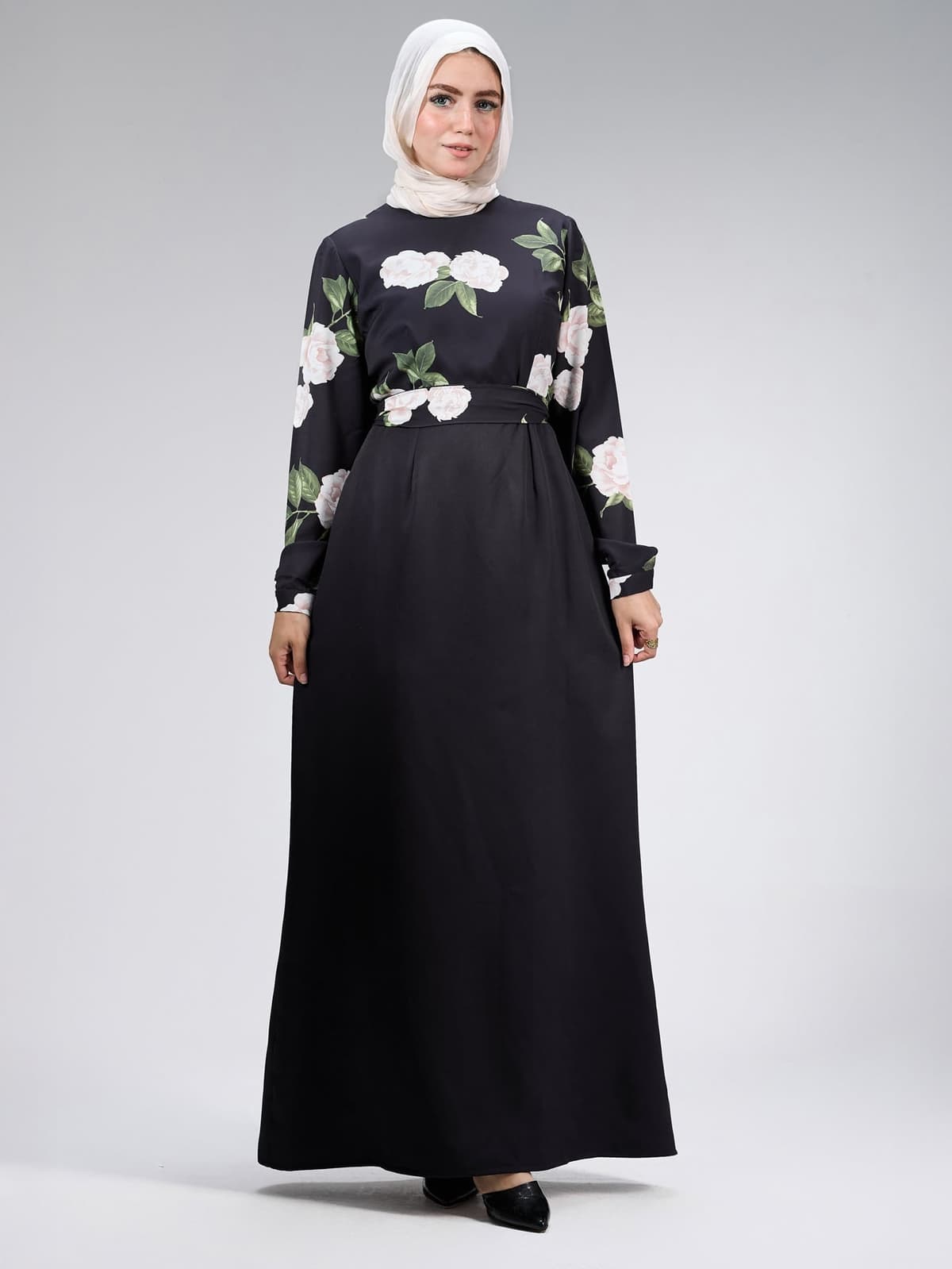 Close-up of floral embroidery on black satin dress