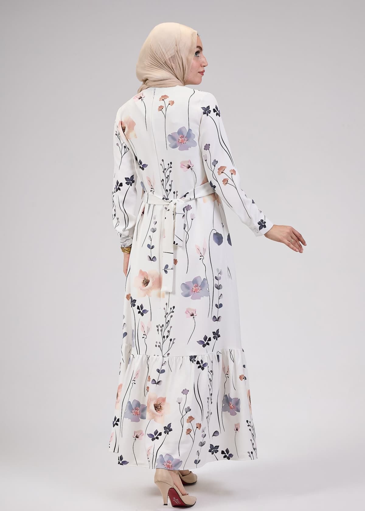 Model holding bag with Lily Bloom Modesty Dress