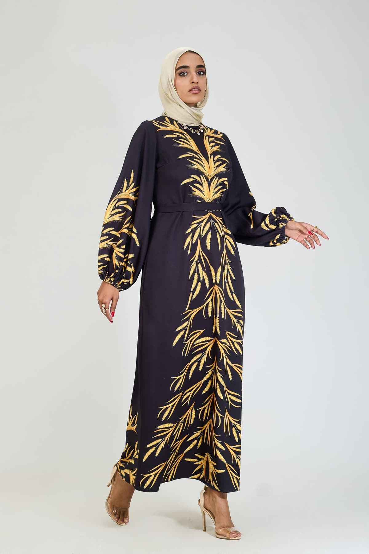 Front view of golden leaf modesty dress in black crepe.