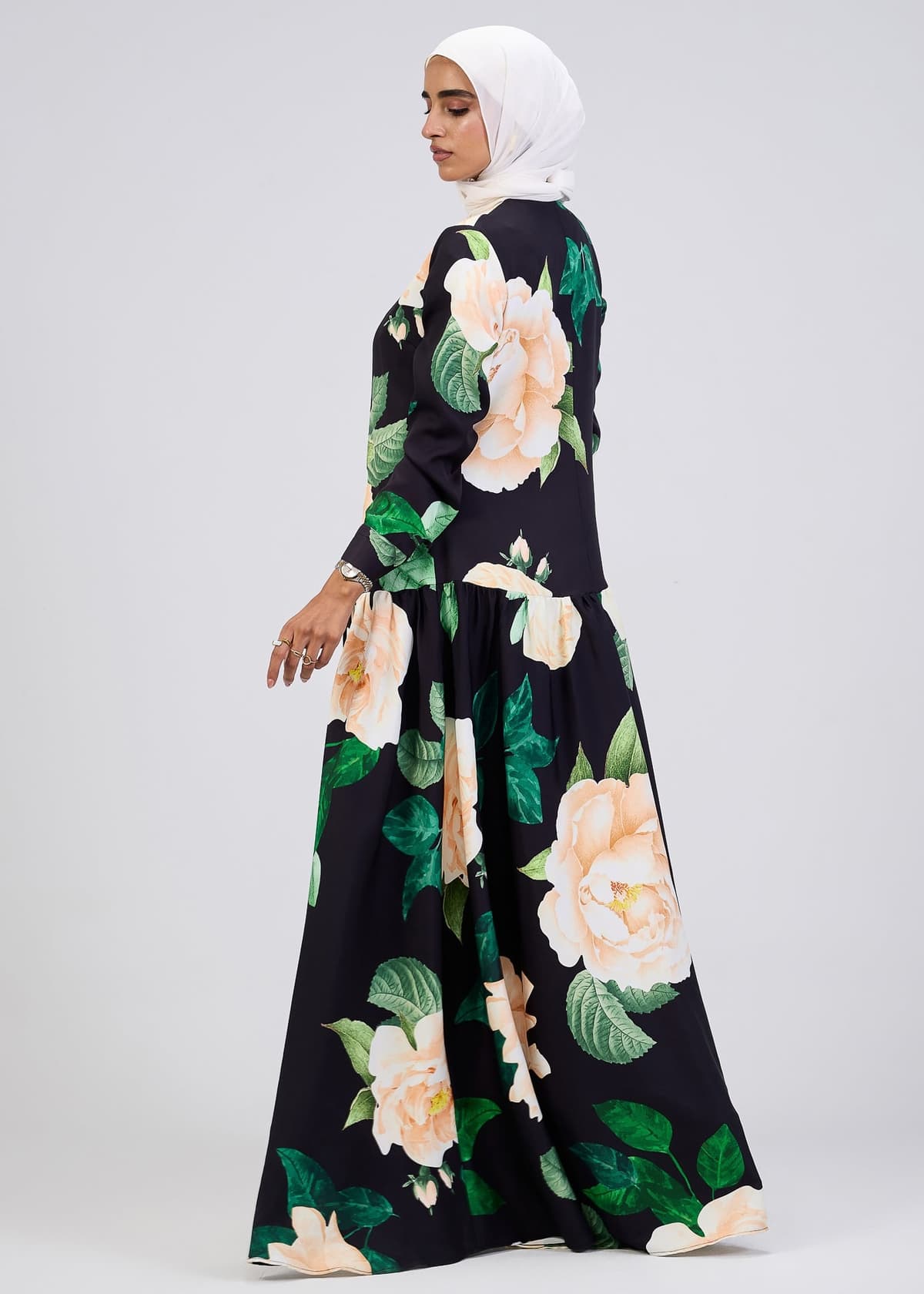 Model twirling in floral print maxi dress