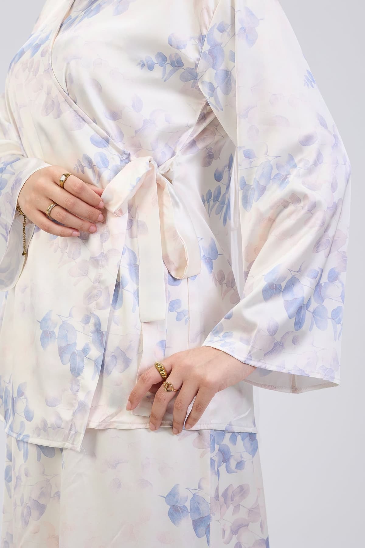 Close-up of satin floral maxi dress details