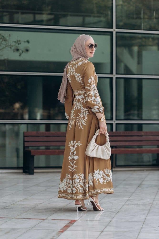 Side view of Sadia Maxi Wrap Dress in mustard brown floral print