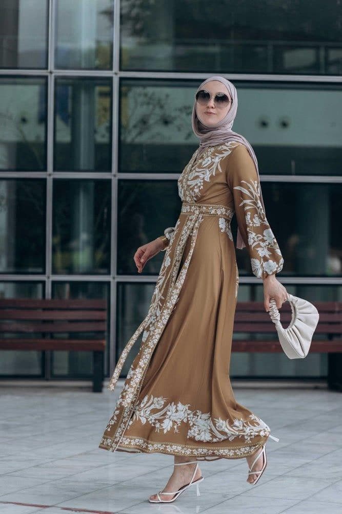 Model walking in Sadia Maxi Wrap Dress, showcasing the flowy design
