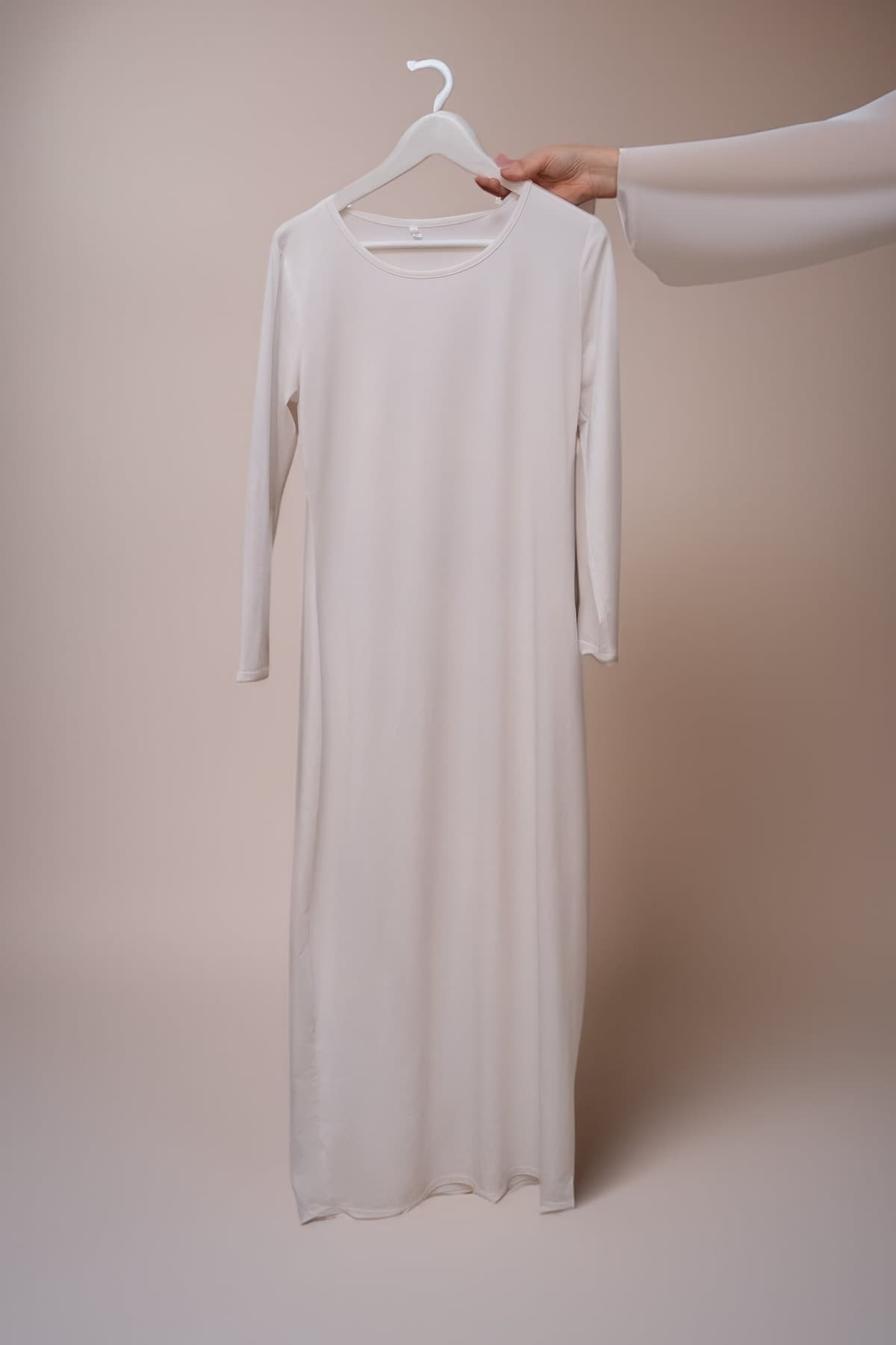 Back view of Marquis Slip Dress Maxi Length and Long Sleeve in White by Annah Hariri