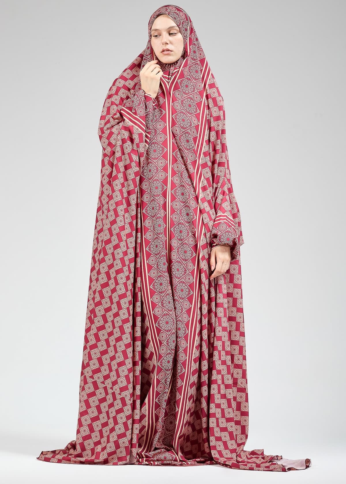 Stylish satin prayer gown for hijab wear in a serene setting