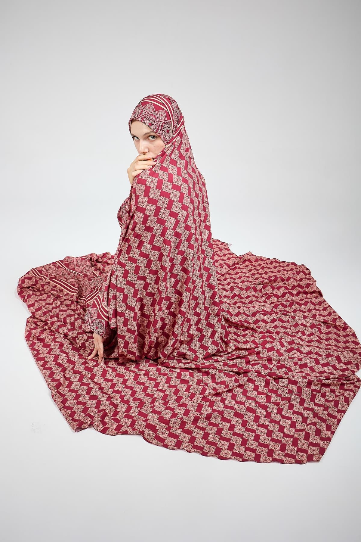 Close-up of geometric floral print on satin prayer gown for hijab wear