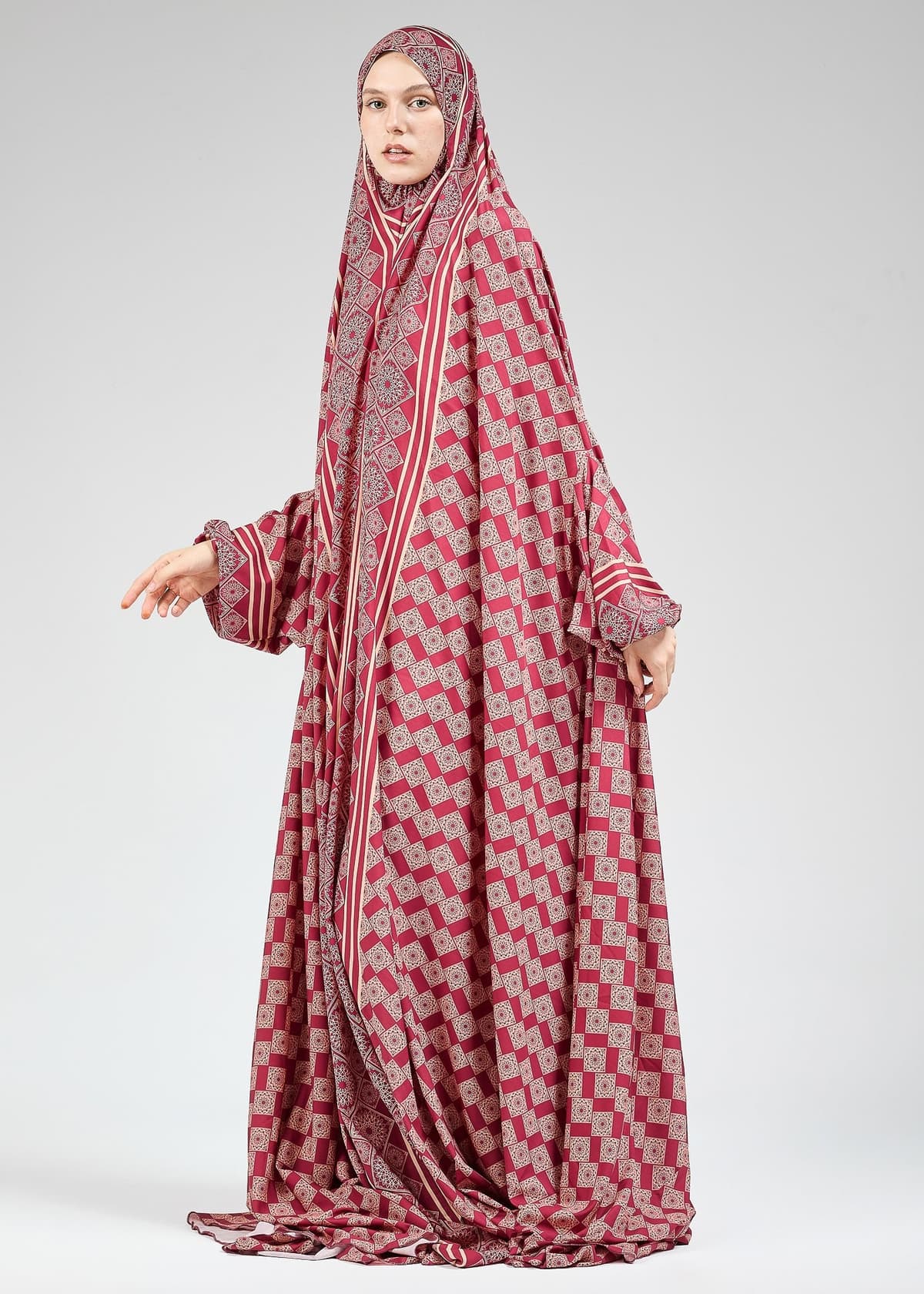 Elasticated cuffs on satin prayer gown for comfort during prayer