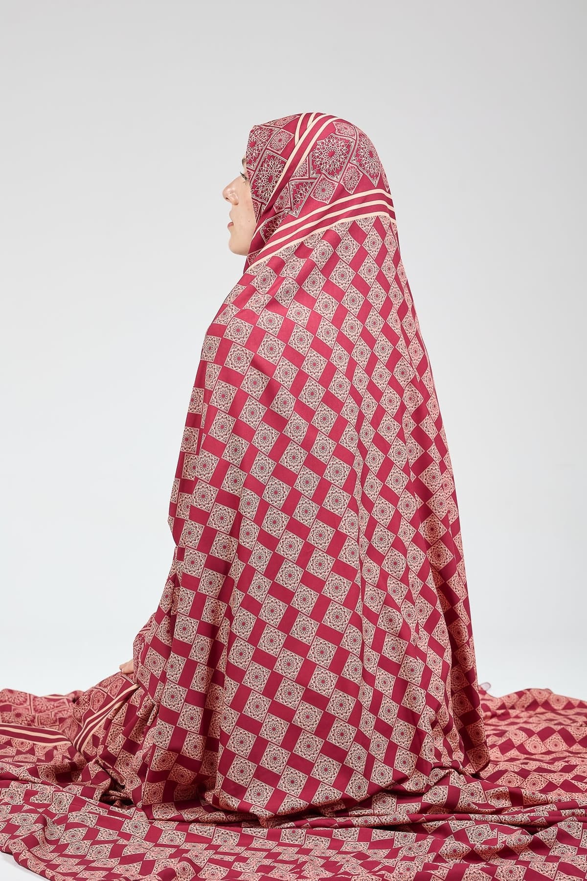 Luxurious satin fabric of prayer gown with intricate design