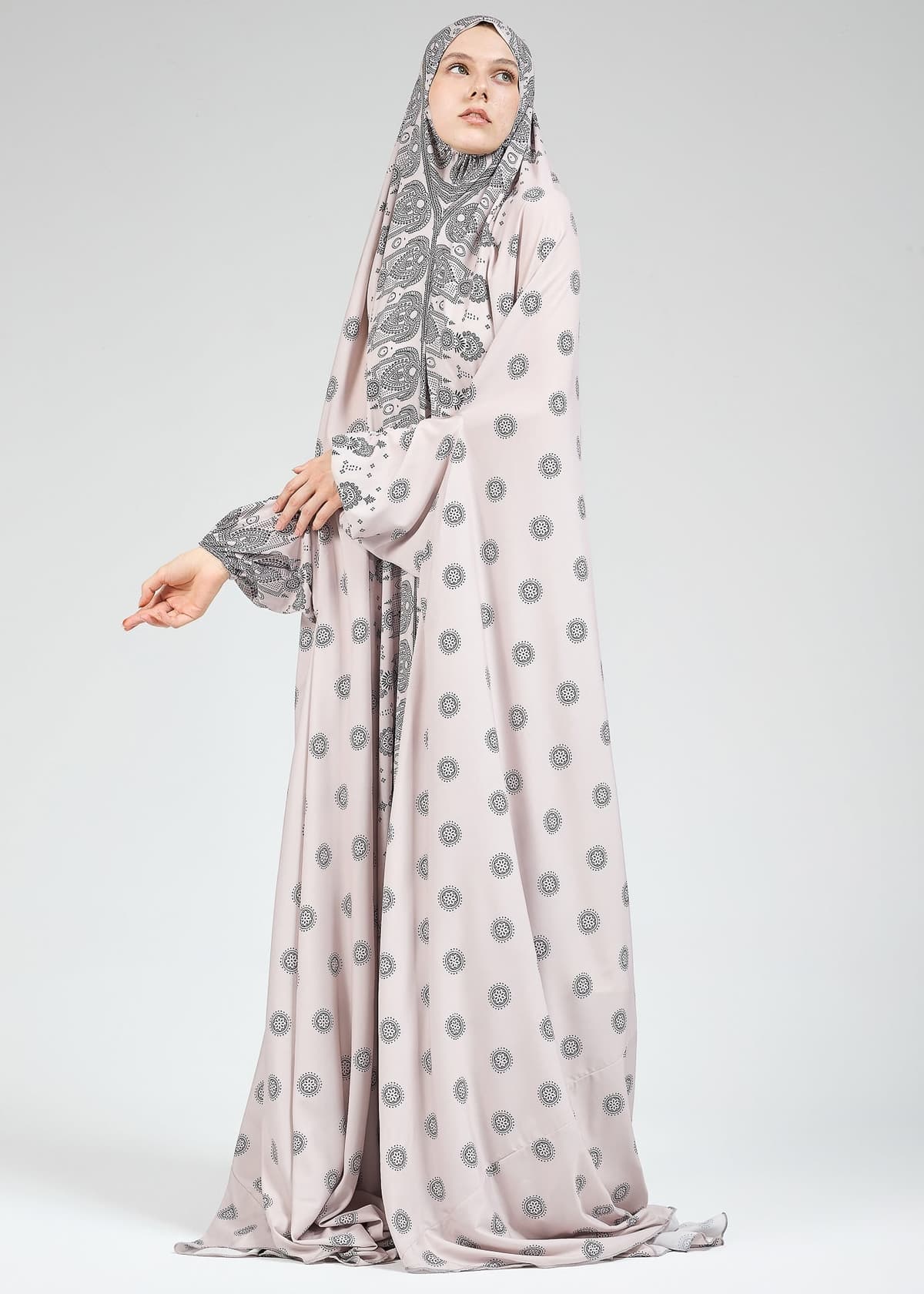 Full-length view of satin prayer gown in paisley design