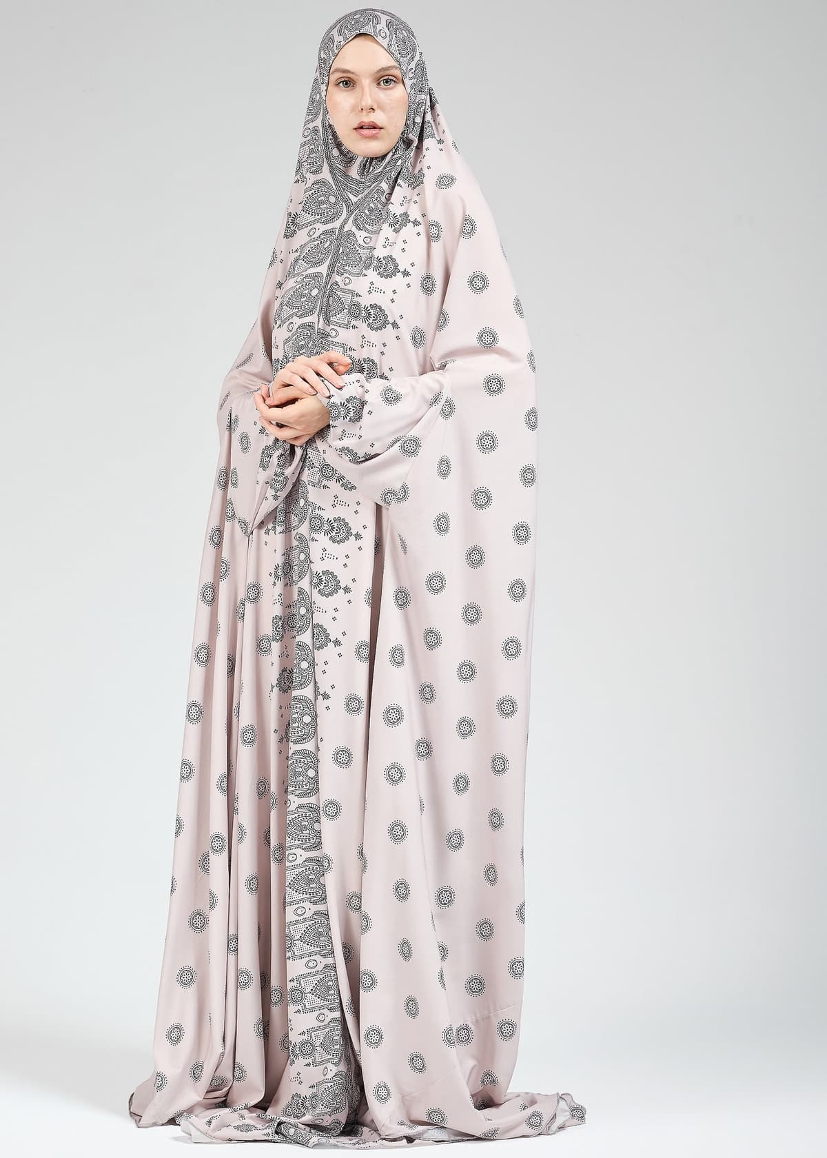Close-up of paisley print on satin prayer gown