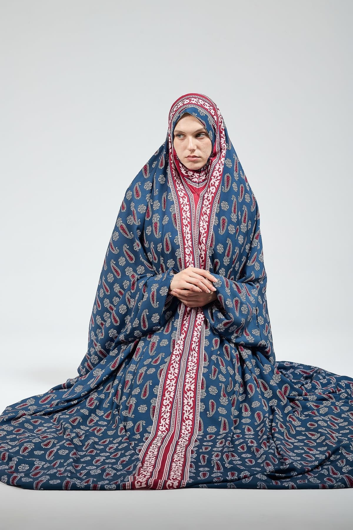 Close-up of paisley pattern on satin prayer gown