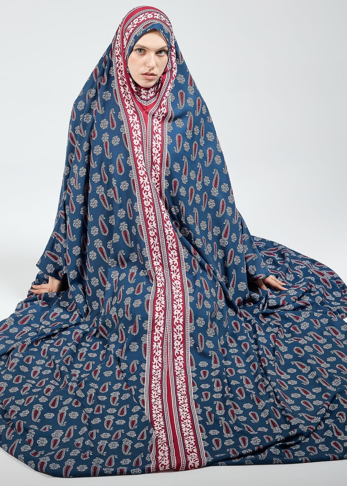 Full-length view of satin prayer gown with paisley accents