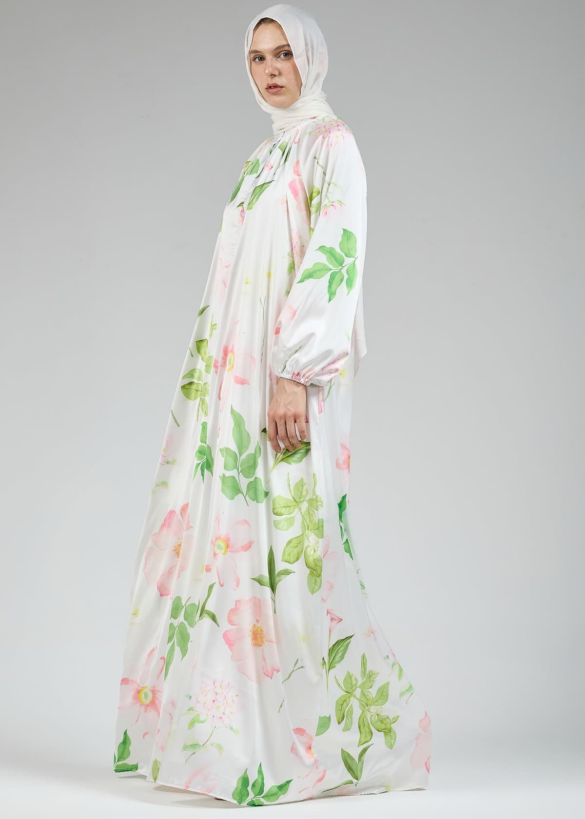 Detailed view of the floral design on the white satin dress