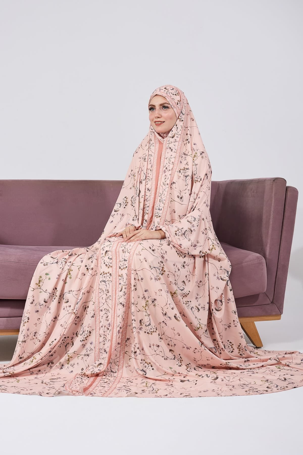 Close-up of satin floral gown showing fabric and details