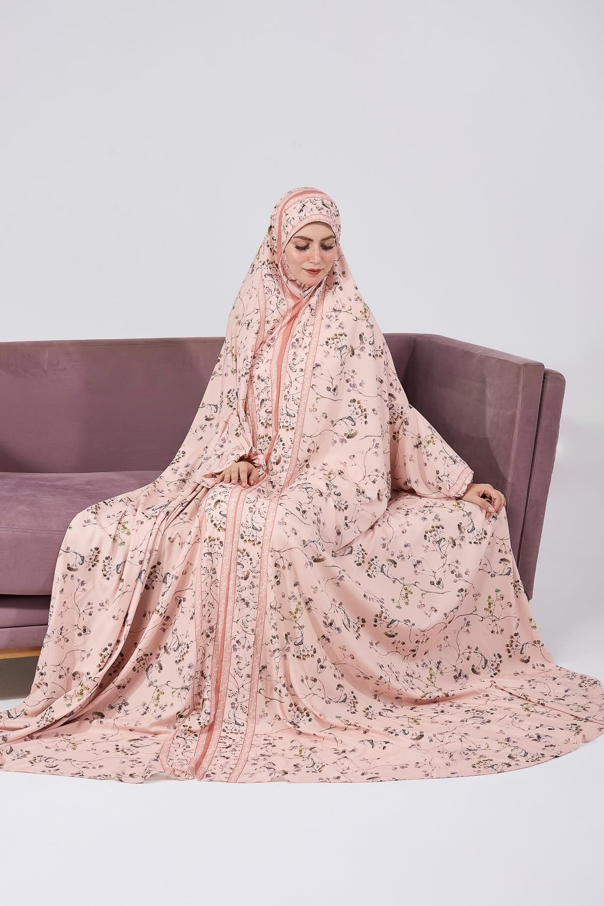 Detailed floral print of the satin prayer gown