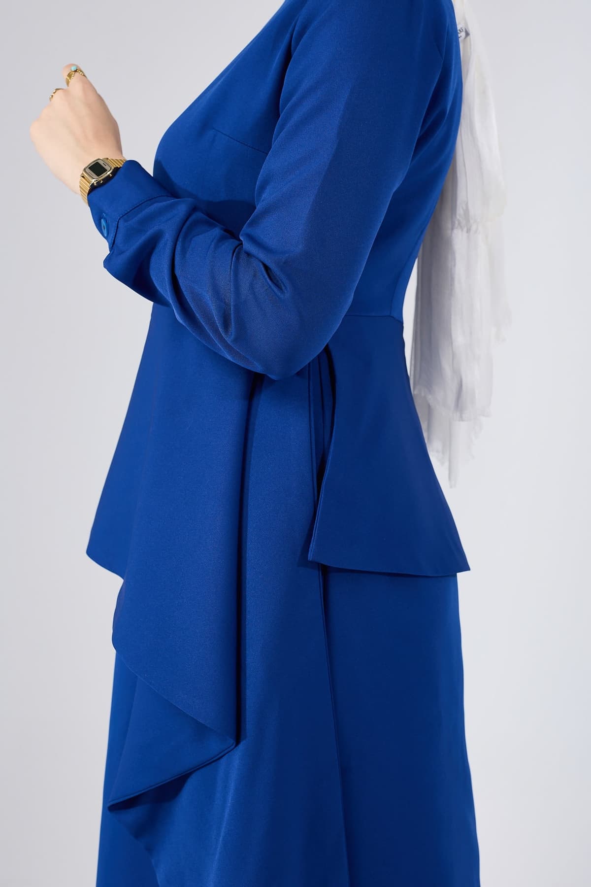 Model wearing Asymmetric Peplum Maxi Dress in Royal Blue