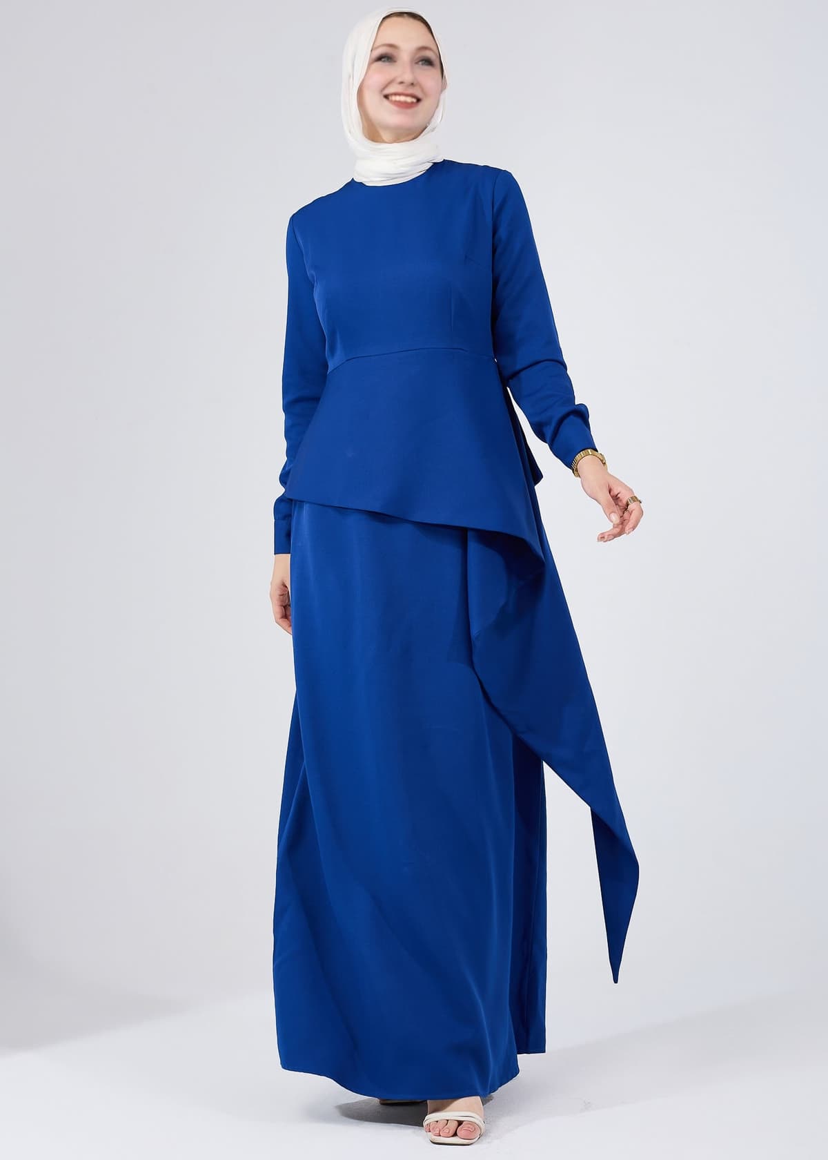 Angled view of Asymmetric Peplum Maxi Dress in Royal Blue