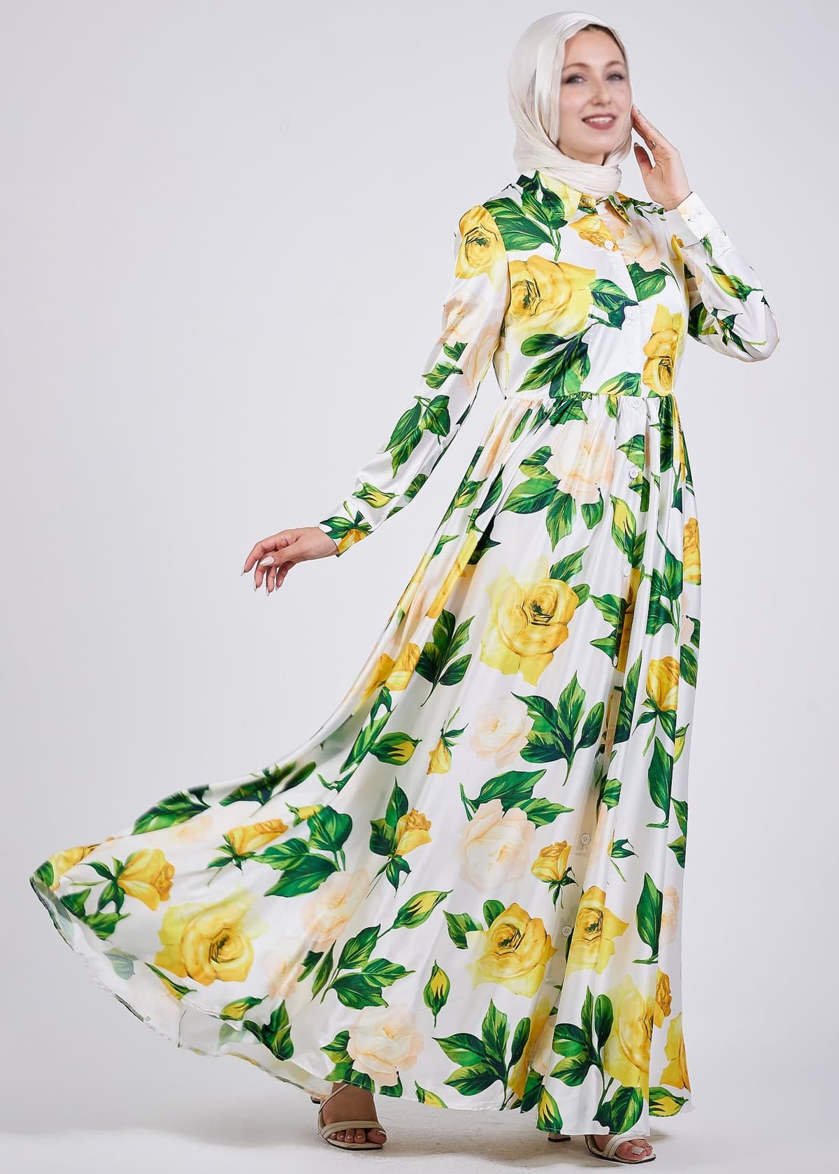 Close-up of button details on the yellow floral satin dress