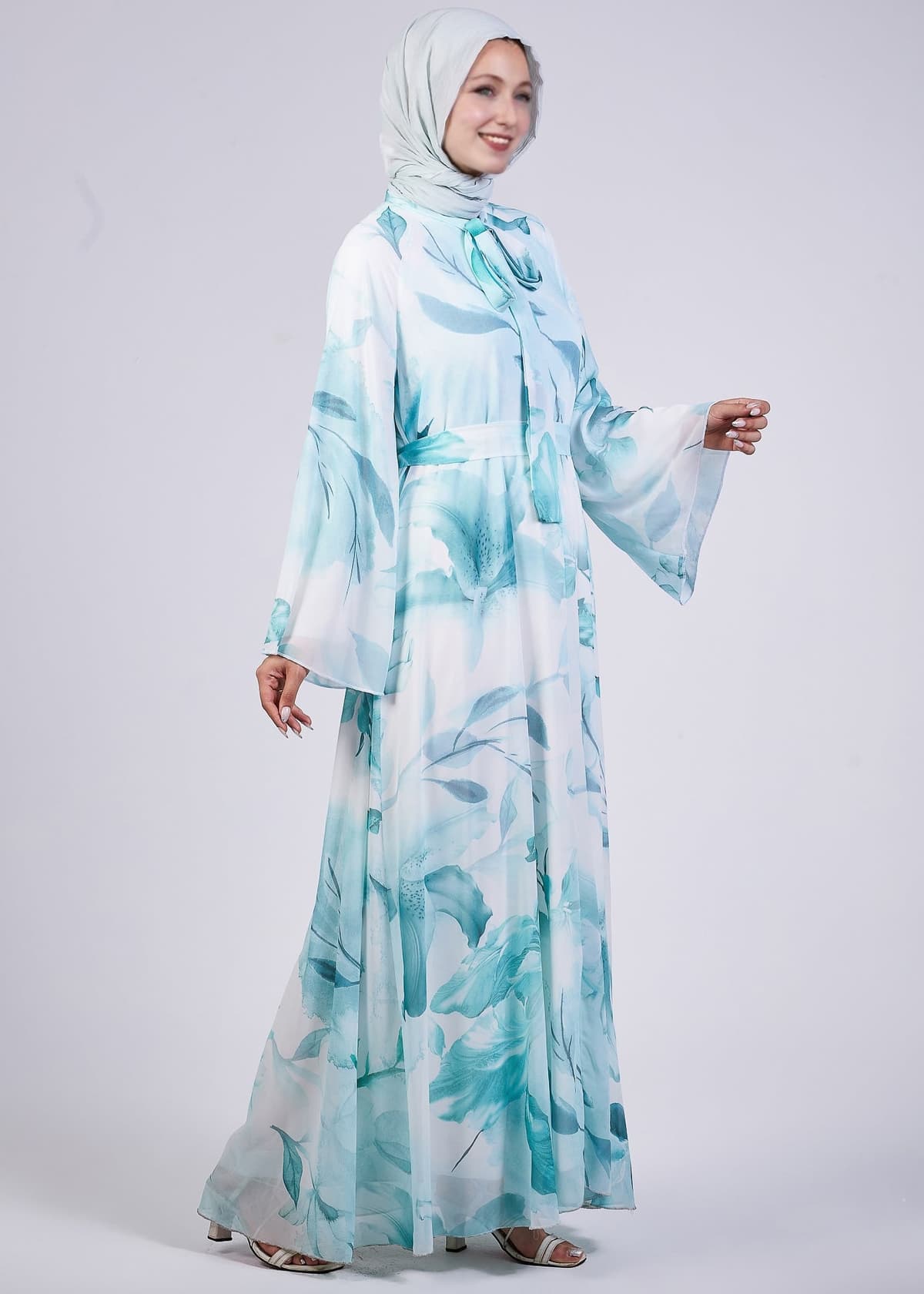 Model smiling in the Elegance Floral Maxi Dress