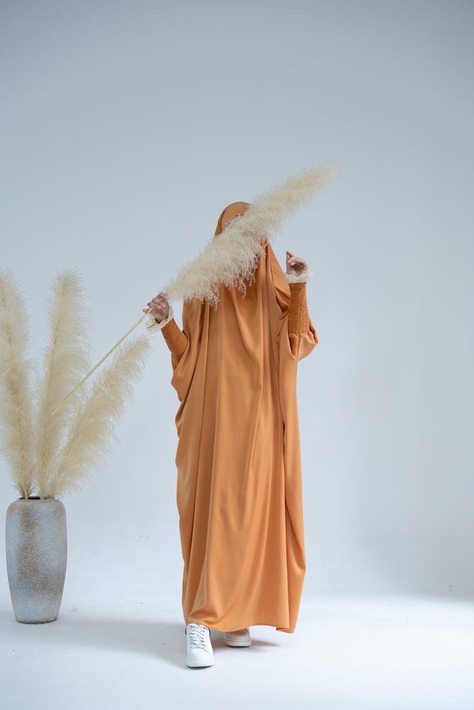 Gretaah prayer gown in khimar style with ribbed sleeve and lace cuff in Orange - ANNAH HARIRI