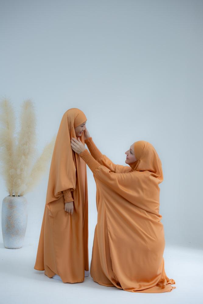 Little Gretaah prayer gown for kids in khimar style with ribbed sleeve cuff in Orange - ANNAH HARIRI