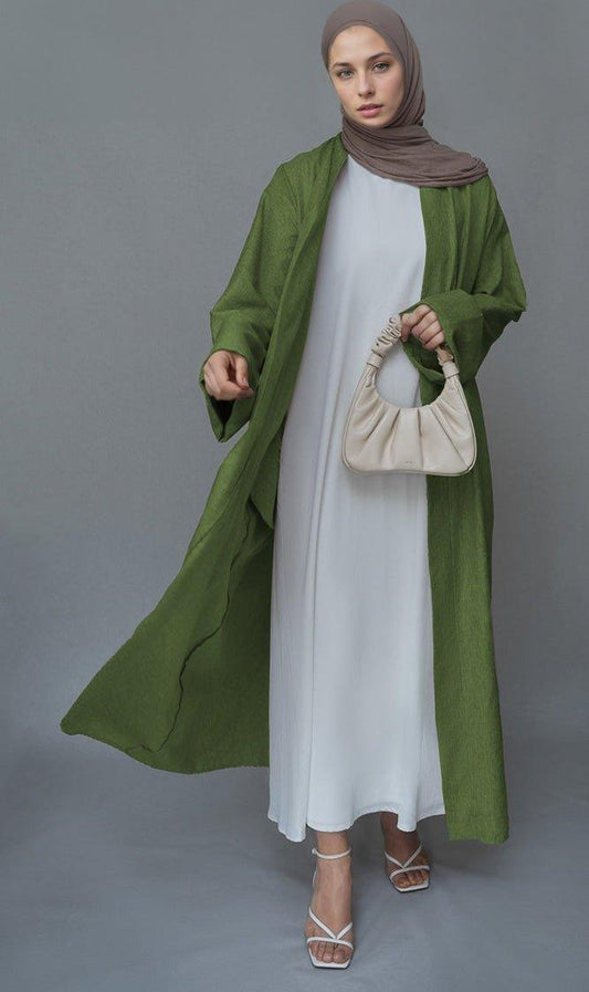 Green Lounia maxi throw over abaya in light linen fabric with a detachable belt - ANNAH HARIRI