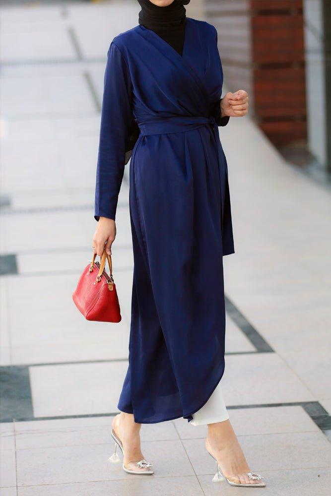 Hala satin maxi uneven cut dress with long sleeve and wrap detail waist and belt in blue - ANNAH HARIRI