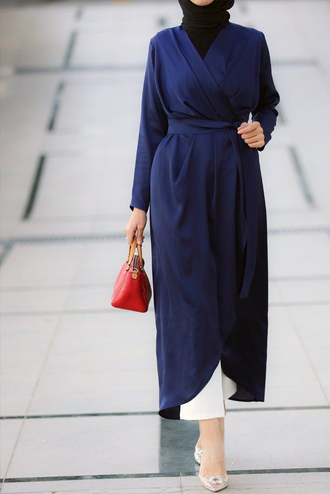 Hala satin maxi uneven cut dress with long sleeve and wrap detail waist and belt in blue - ANNAH HARIRI